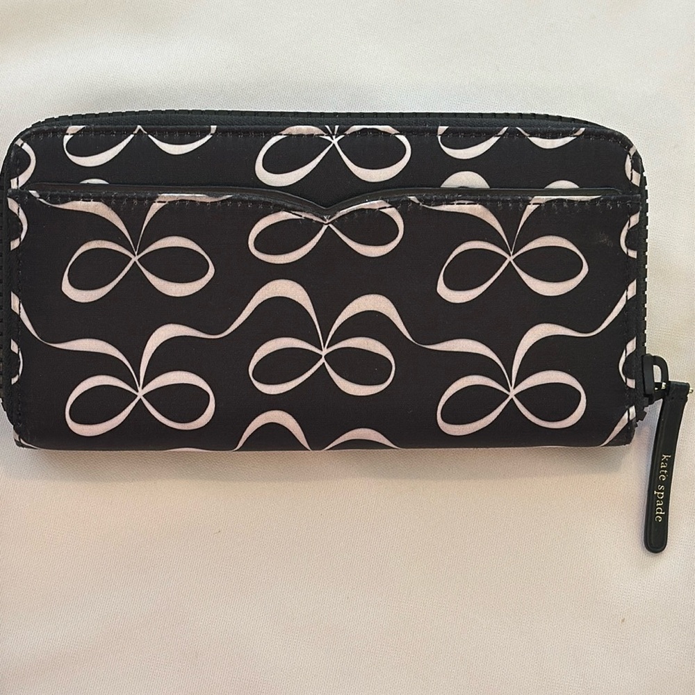 KATE SPADE BLACK CONTINENTAL WALLET WITH WHITE BOWS NYLON. Gently used.